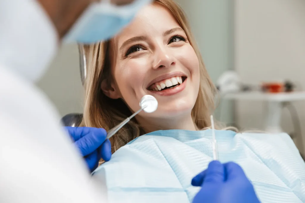woman talking to dentist about oral hygiene