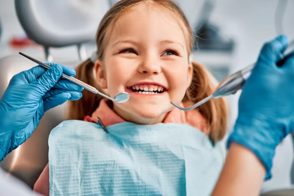 Image of a girl getting her team cleaning at our dentist office